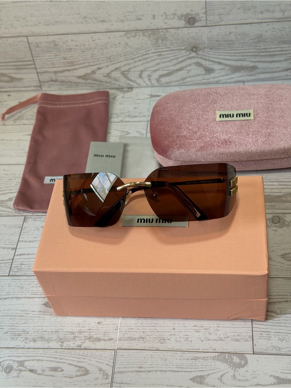 Miu Miu Brown Oversized Shield Sunglasses with Gold Accents